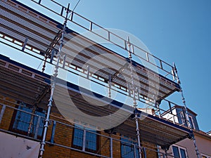 Scaffolds on a house building under renovations