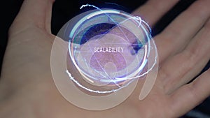 Scalability text hologram on a female hand