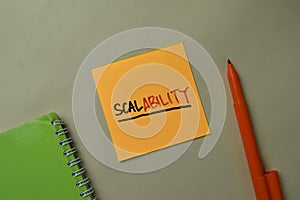 Scalability write on sticky notes isolated on office desk