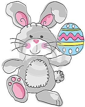 Cute funny gray rabbit holding a easter egg