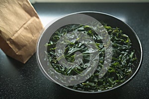 Scalded wakame seaweed in bowl