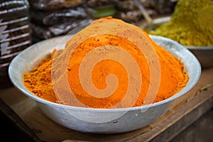 Scale with curcuma powder on a market