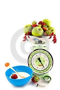 Scale with fruit for diet and yogurt