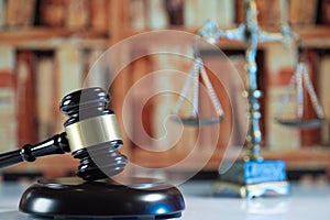 Scale of justice. Wooden judge`s gavel. The criminal law.