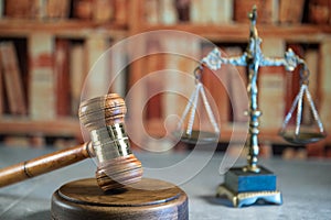 Scale of justice. Wooden judge`s gavel. The criminal law.