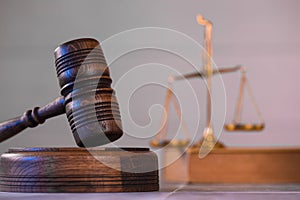 Scale of justice. Wooden judge`s gavel. The criminal law.