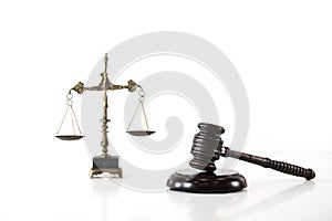 Scale of justice. Wooden judge`s gavel. The criminal law.