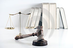Scale of justice. Wooden judge`s gavel. The criminal law.