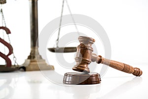 Scale of justice. Wooden judge`s gavel. The criminal law.