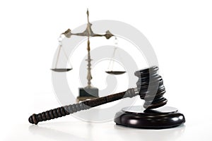 Scale of justice. Wooden judge`s gavel. The criminal law.