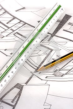 A scale ruler and pencil on a technical drawing