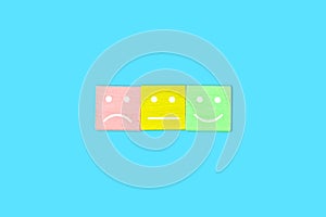 Scale of three untypical smilies symbolizing customer satisfaction feedback.