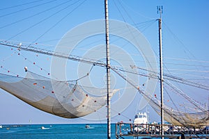 Scales for fishing, huge nets that come down to the sea and then after a while they retire on with fish of any size and type, they