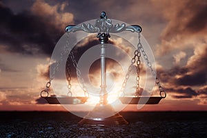 Scales Of Justice On Sunrise Landscape Background photo