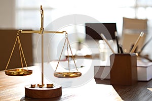 Scales on table in lawyer`s