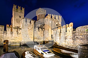 Scaligero Castle over the Garda lake in Sirmione at night, Italy