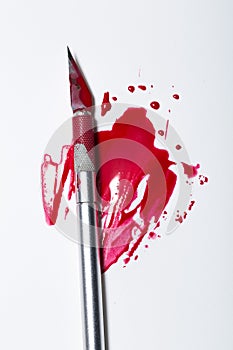 Scalpel blade with blood