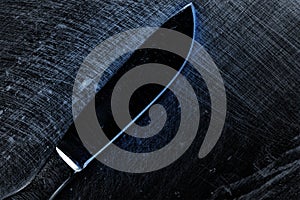 Scalpel on the scraped metal surface