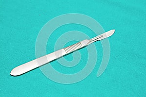 Scalpel on sterile table