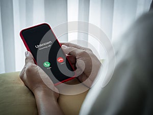 Scam call with unknown caller, scammer calls, fraudulent phone calls concept. Unknown incoming call with accept and decline button photo