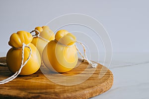 Scamorza cheese on a wooden board, marble background