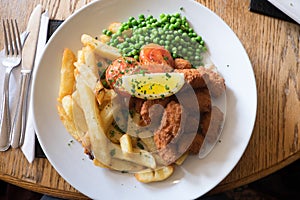 Scampi, chips and peas: traditional British pub meal - elevated view