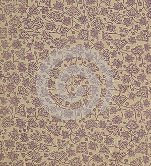 Scan the flyleaf of an old book, yellow-gray-brown, with dense and intricate floral pattern. photo
