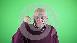 Scandalized senior man in glasses agitate with hand isolated on chroma key