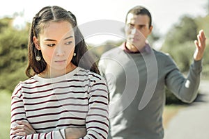 Scandalous short-haired man sorting things out with girlfriend photo