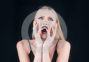 Scandalous woman concept. Girl with screaming face. Dark lips and nails manicure. photo