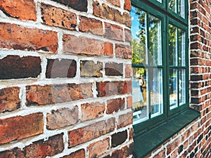 Scandinavian architecture style brickwork pattern with wooden window, texture of a brick wall in perspective