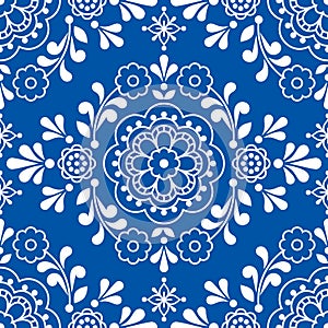 Scandinavian floral folk art vector seamless pattern, cute ornamental design perfect for textile in white on navy blue