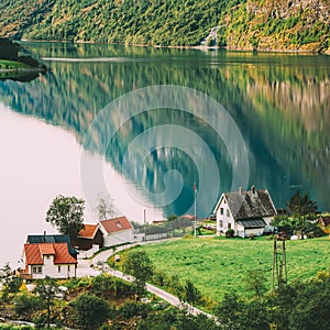 Scandinavian houses on shore of the narrowest fjord in Norway - Naeroyfjord