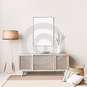 Scandinavian interior design of living room with rattan console, wooden chair, mock up poster frame