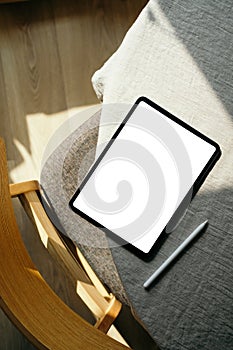 Scandinavian, nordic style home office desk workspace with blank screen tablet mockup and drawing pencil. Flat lay, top view