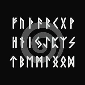 Scandinavian runes white letters on black background. Runic alphabet. Ancient occult symbols.