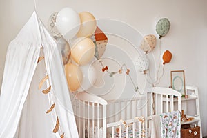 Scandinavian style white interior children's room, bedroom, nursery. Baby cot with canopy.