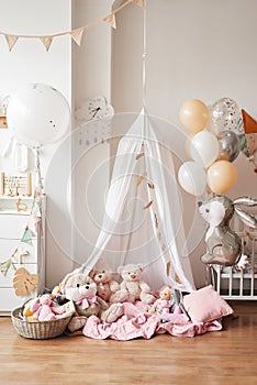 Scandinavian style white interior children's room, bedroom, nursery. Baby cot with canopy tent