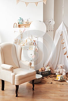 Scandinavian style white interior children`s room, bedroom, nursery. Baby cot with canopy. Wooden shelves and toys. Canopy tent,