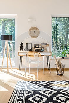 Scandinavian style workspace with clock