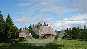 Scandinavian timbered church or stavkyrka of Eksharad in Sweden photo