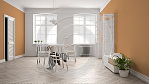Scandinavian white and orange dining room, wooden herringbone parquet floor, table and chairs, windows, door and radiators.