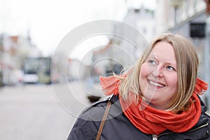 Scandinavian woman looking at copyspace in town