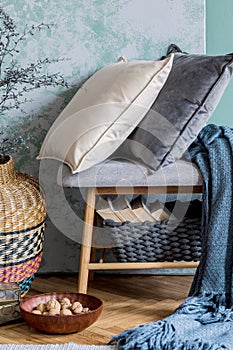 Scandinavian wooden bench with pillows and plaid.