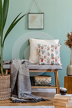 Scandinavian wooden bench with pillows and plaid.