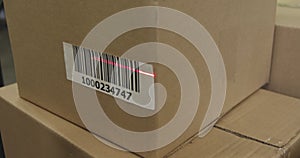 Scanning a barcode on a box in a warehouse