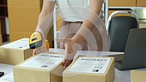 Scanning Barcode on Shipping Box with Scanner stock photo