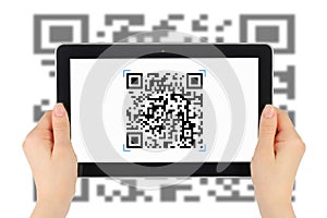 Scanning of QR code by tablet pc photo