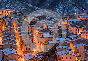 The beautiful Scanno covered in snow during a cold winter evening. Abruzzo, central Italy. photo