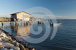 SCARDOVARI, ITALY, 2016-08-06: Fishing huts at Scardovari lagoon